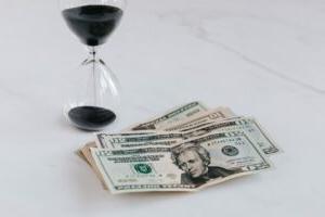 Money next to a timer.